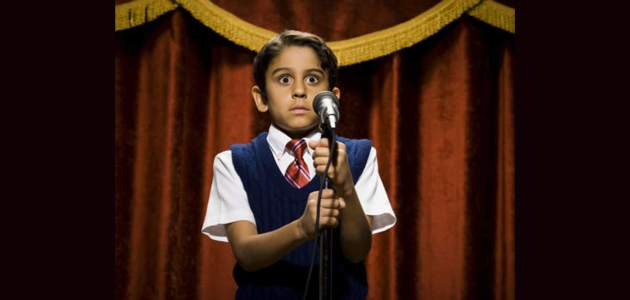 Young kid in fear for speaking into a mike